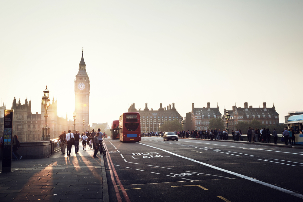 people on Westminster Bridge at sunset, London, UK